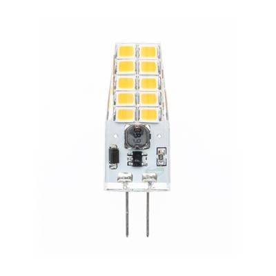 Gros plan d'une petite lampe LED avec un boîtier en plastique transparent, des puces jaunes et deux broches inférieures pour la connexion électrique sur un fond neutre.
