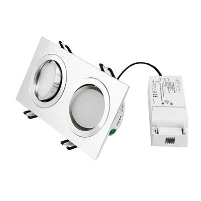 Double encastré LED rectangulaire avec finition métallique, fond noir, composant électrique blanc pour des solutions d'éclairage modernes.