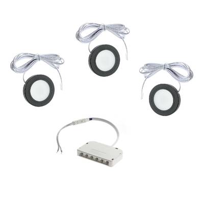 Kit d'éclairage LED puck avec lampes rondes, câbles de connexion et alimentation multiport.