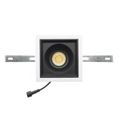 Spot encastré LED rectangulaire avec bande décorative blanche, ampoule centrale, supports de montage et cordon d'alimentation noir latéral. Idéal pour les solutions d'éclairage contemporaines.