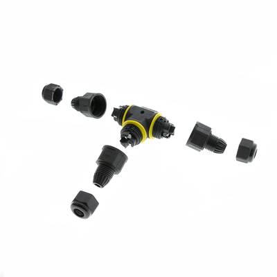 Connecteurs et raccords désassemblés en plastique noir et jaune sur fond blanc, idéaux pour les installations d'éclairage LED.