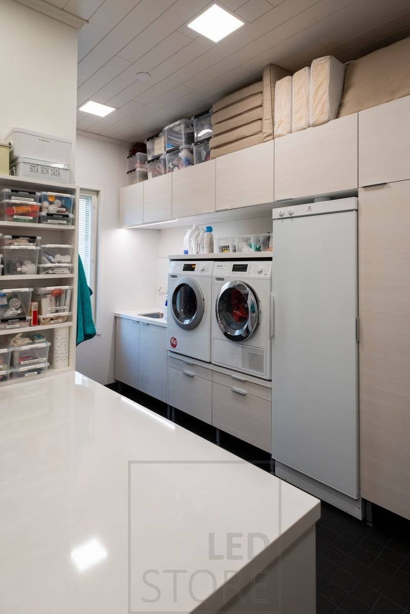 UPPOAVA led panel lights in the ceiling of the utility room in size 300x300. Ledstore.fi