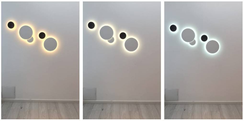 Appliques murales rondes Eclipse regroupées en une série de cinq luminaires.