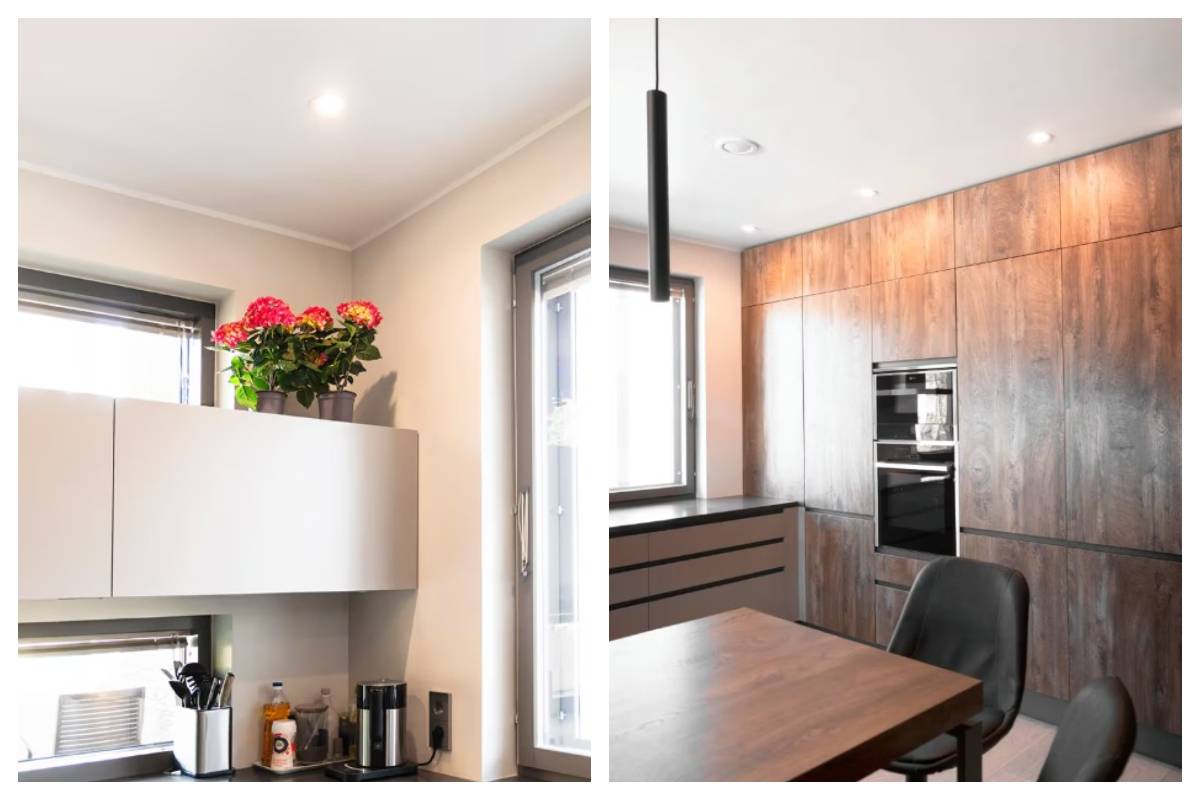 La cuisine est éclairée par des spots LED encastrés dans le plafond et par une suspension noire minimaliste sur la table.
