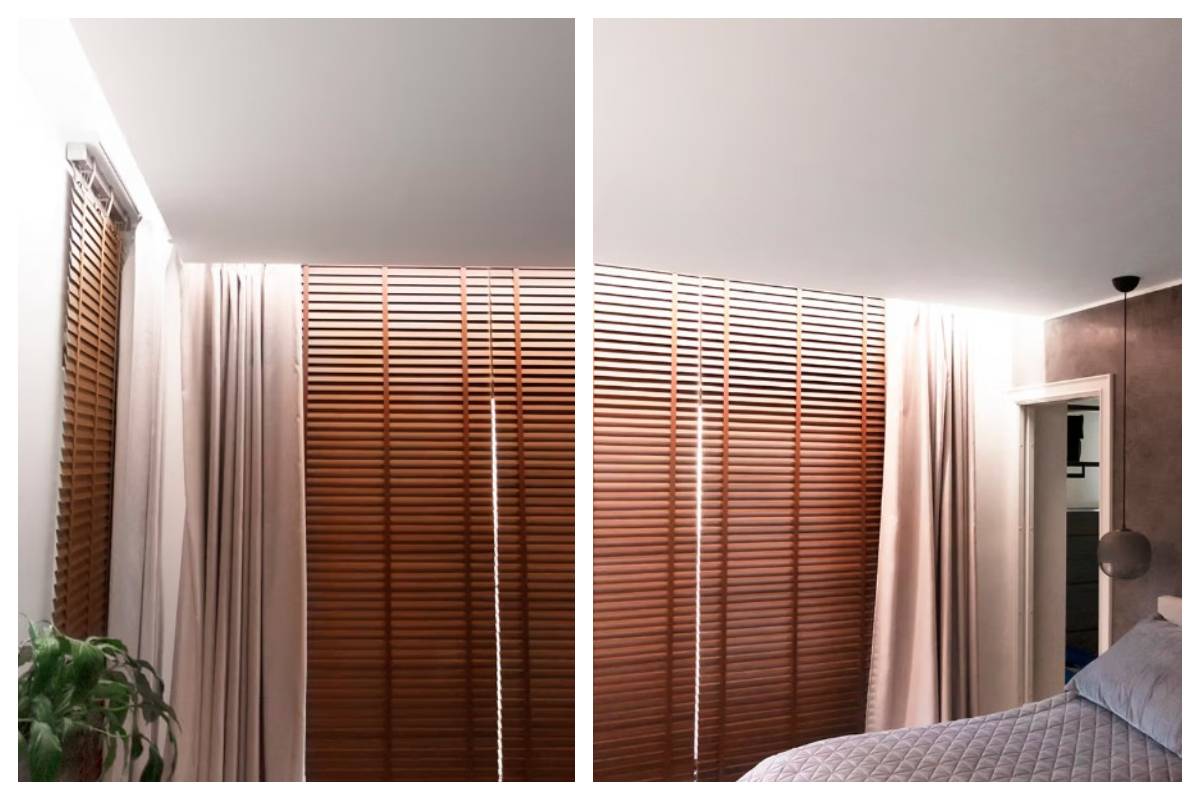 Une chambre à coucher moderne à Kaitamäki, Espoo - des stores en bois, des rideaux beiges, de la verdure et un lit bien fait créent l'atmosphère d'une maison familiale paisible. L'ensemble est complété par l'éclairage LED soigneusement conçu par LedStore.fi, qui souligne le caractère confortable et le style de l'espace.