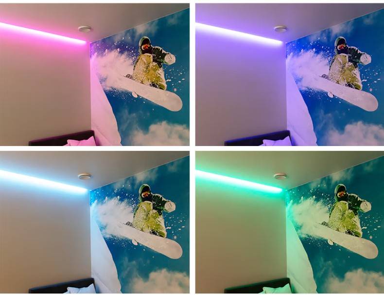 Une peinture murale sur le thème du snowboard, animée par des lampes LED de LedStore.fi aux couleurs interchangeables - rose, violet, bleu et vert - crée un éclairage spectaculaire et dynamique dans la maison d'une famille d'Espoo à Kaitamäki.