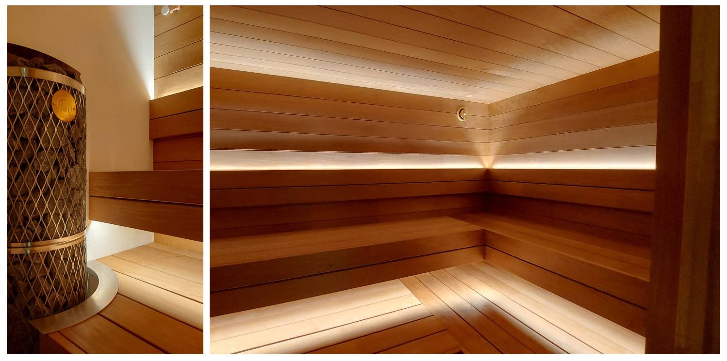 Sauna : bandeau lumineux sous le plafond et en haut du dossier. Photo.